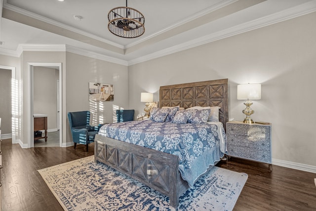 bedroom with crown molding, baseboards, wood finished floors, and a notable chandelier