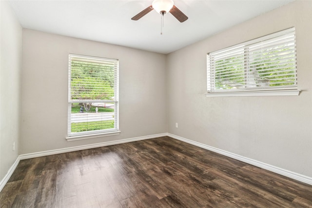 unfurnished room with baseboards, a ceiling fan, and wood finished floors