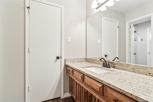 bathroom featuring vanity and wood finished floors