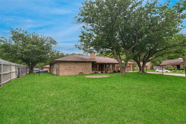 view of yard featuring a fenced backyard
