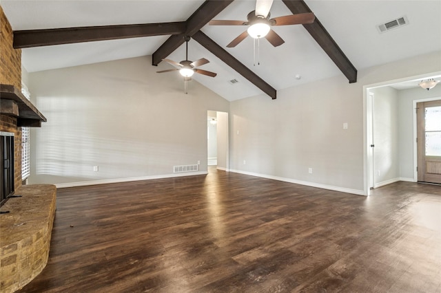 unfurnished living room featuring a ceiling fan, dark wood-style flooring, visible vents, a fireplace, and lofted ceiling with beams