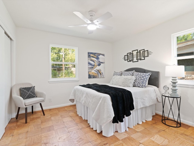 bedroom featuring ceiling fan, baseboards, and a closet