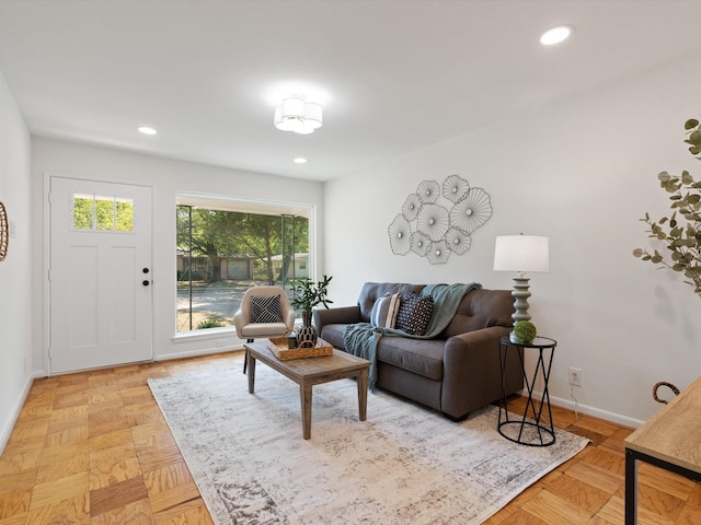 living room with recessed lighting and baseboards