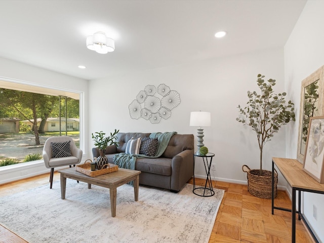 living room with recessed lighting and baseboards