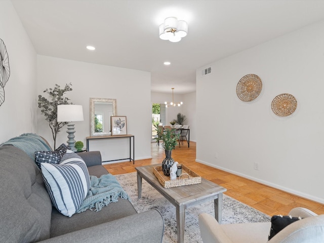 living room featuring baseboards, recessed lighting, a chandelier, and visible vents