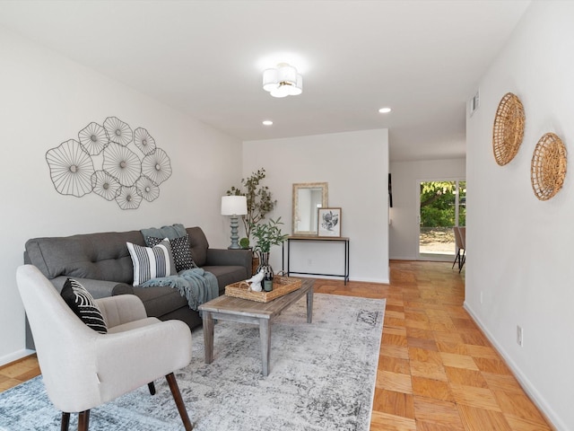 living area with baseboards and recessed lighting