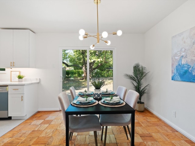 dining space with an inviting chandelier and baseboards