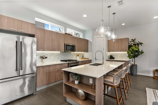 4935 Zuma Ct, Dallas, TX 75206 - kitchen featuring high end appliances, a sink, light countertops, modern cabinets, and recessed lighting