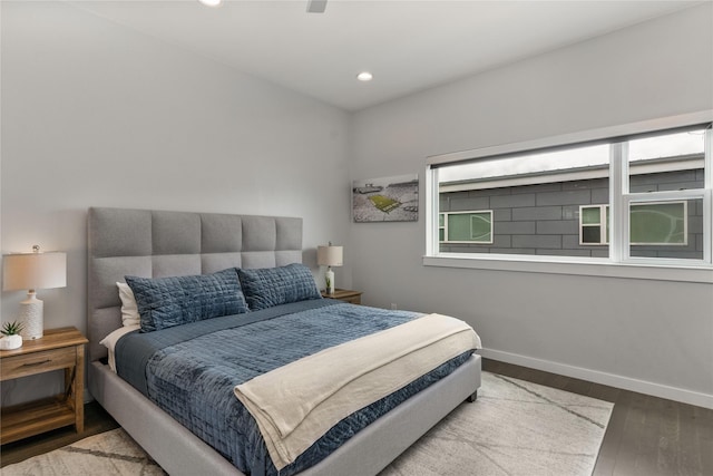bedroom with baseboards, recessed lighting, and wood finished floors