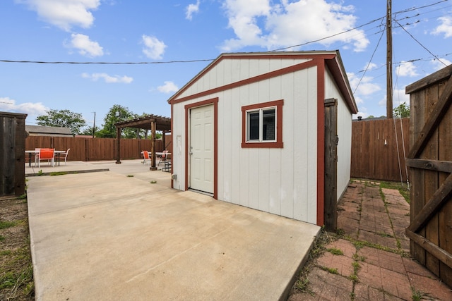 view of outbuilding featuring a fenced backyard and an outbuilding