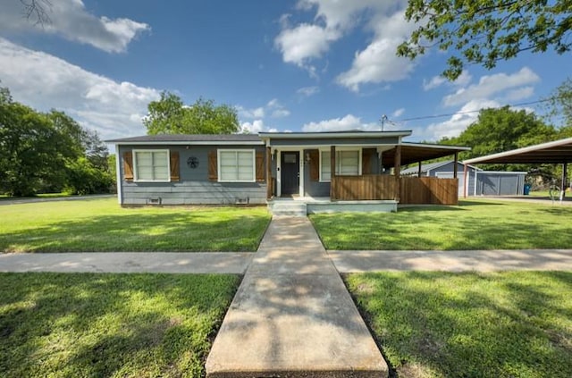 bungalow-style house with a front lawn, fence, and covered porch