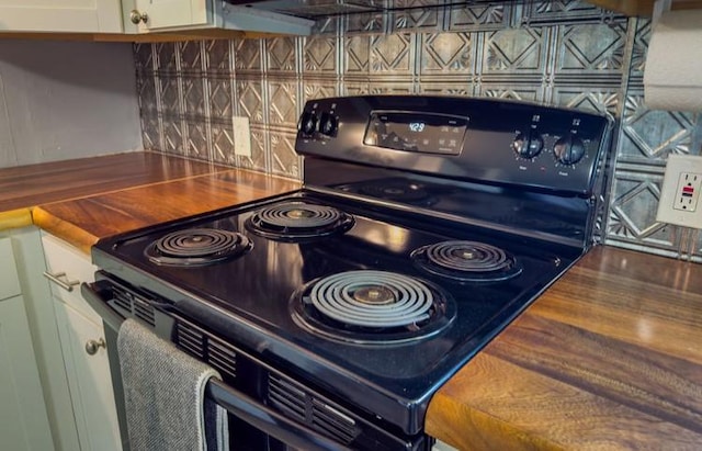 interior space featuring butcher block counters and black electric range