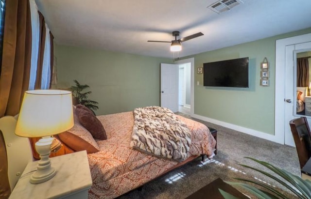 carpeted bedroom with baseboards, visible vents, and ceiling fan