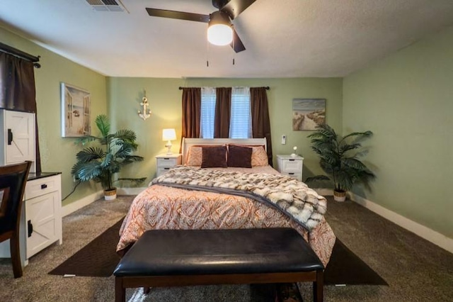 bedroom with carpet flooring, baseboards, visible vents, and ceiling fan