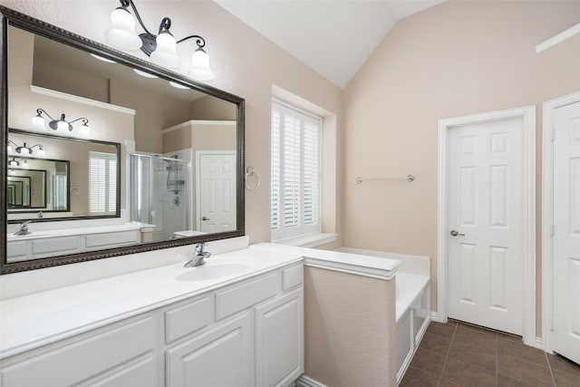 full bath featuring vanity, tile patterned floors, a bath, a stall shower, and vaulted ceiling