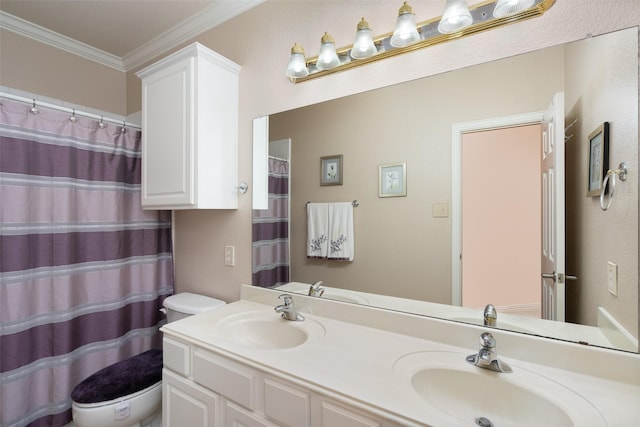 full bath with a sink, crown molding, toilet, and double vanity