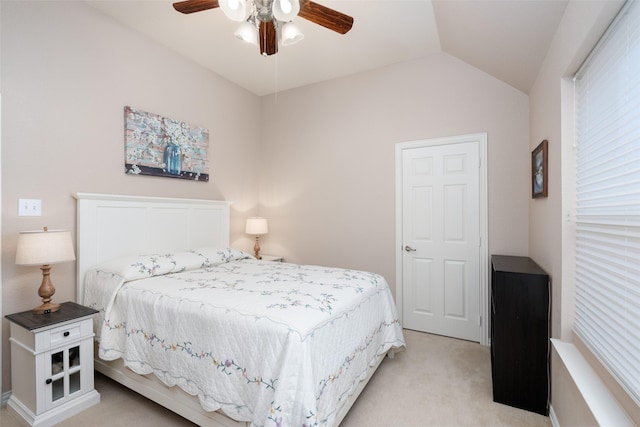 bedroom with light colored carpet, a ceiling fan, and lofted ceiling