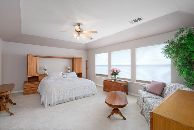 bedroom featuring baseboards, ceiling fan, light colored carpet, and visible vents