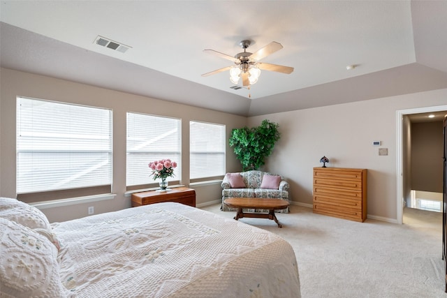 bedroom with a ceiling fan, baseboards, visible vents, and light carpet