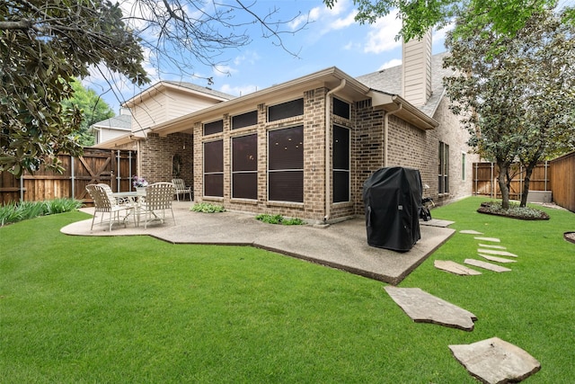1222 Bridgeway Ln, Allen, TX 75013 - back of house with a patio, a chimney, and brick siding