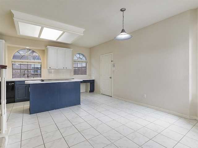 kitchen with light countertops, white cabinetry, tasteful backsplash, and black dishwasher