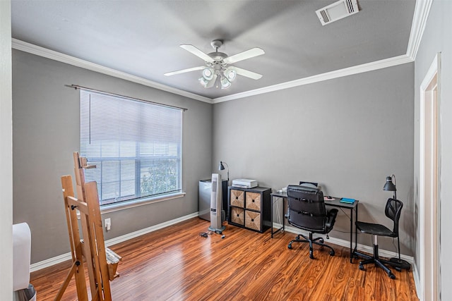 office with crown molding, ceiling fan, baseboards, wood finished floors, and visible vents