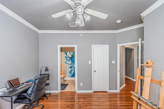office area with ornamental molding, a ceiling fan, wood finished floors, and visible vents