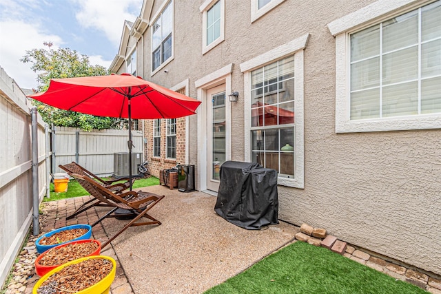 view of patio / terrace featuring a fenced backyard and central AC unit