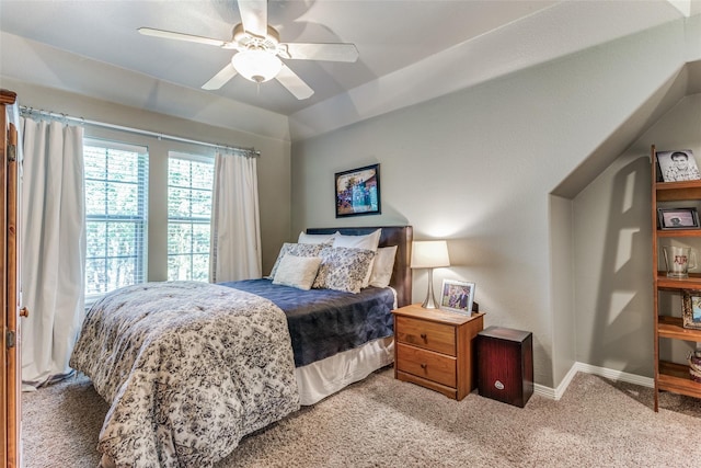 carpeted bedroom featuring a ceiling fan and baseboards