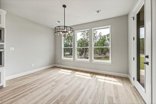 285 Lake Ridge Ct, Bluff Dale, TX 76433 - unfurnished dining area with light wood finished floors, a chandelier, and baseboards