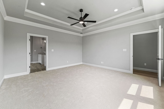 285 Lake Ridge Ct, Bluff Dale, TX 76433 - spare room with a tray ceiling, a ceiling fan, carpet flooring, crown molding, and baseboards