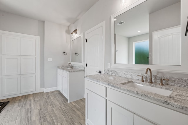 285 Lake Ridge Ct, Bluff Dale, TX 76433 - bathroom featuring two vanities and baseboards