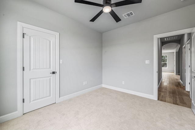 285 Lake Ridge Ct, Bluff Dale, TX 76433 - carpeted empty room with a ceiling fan, arched walkways, and baseboards