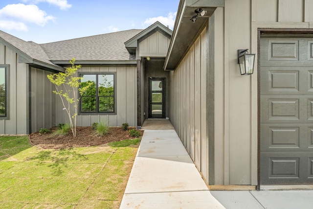 285 Lake Ridge Ct, Bluff Dale, TX 76433 - view of exterior entry with board and batten siding, roof with shingles, and a yard