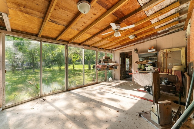unfurnished sunroom featuring ceiling fan