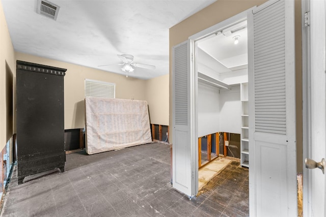 unfurnished bedroom with visible vents, a ceiling fan, and tile patterned floors