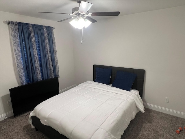carpeted bedroom with baseboards and a ceiling fan