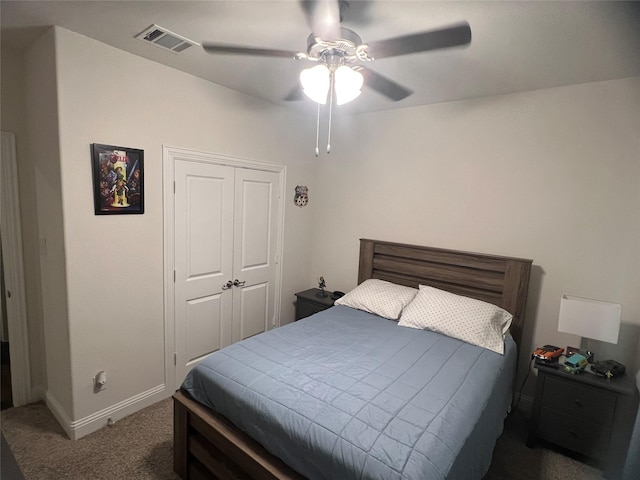 carpeted bedroom featuring visible vents, baseboards, ceiling fan, and a closet