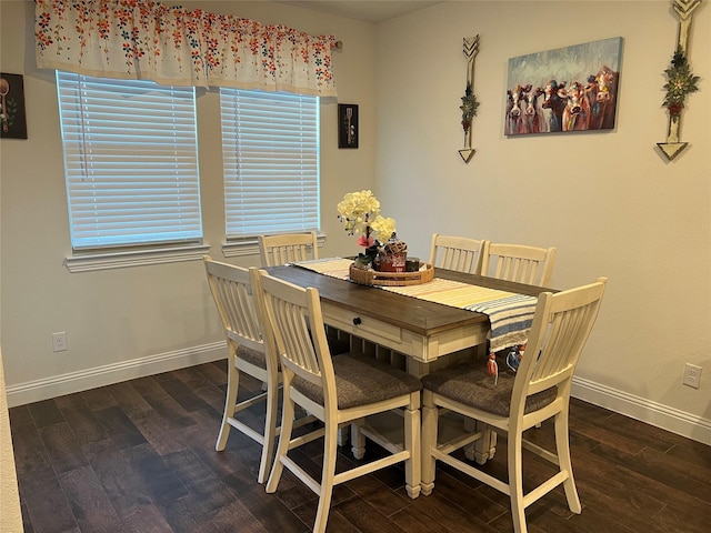 dining area with baseboards, wood finished floors, and a wealth of natural light