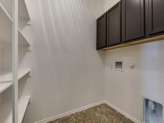 laundry room featuring cabinet space, washer hookup, baseboards, and gas dryer hookup