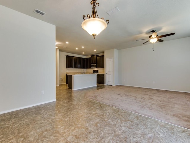 unfurnished living room featuring recessed lighting, baseboards, ceiling fan, and visible vents