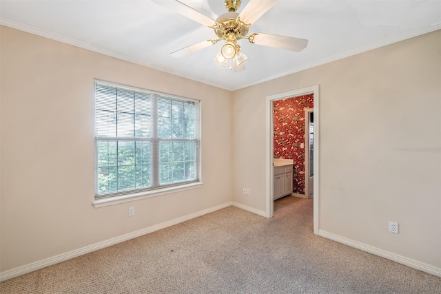 unfurnished room with baseboards, ornamental molding, light carpet, and ceiling fan
