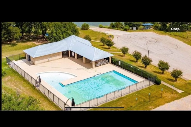 view of swimming pool with fence, a fenced in pool, and a patio