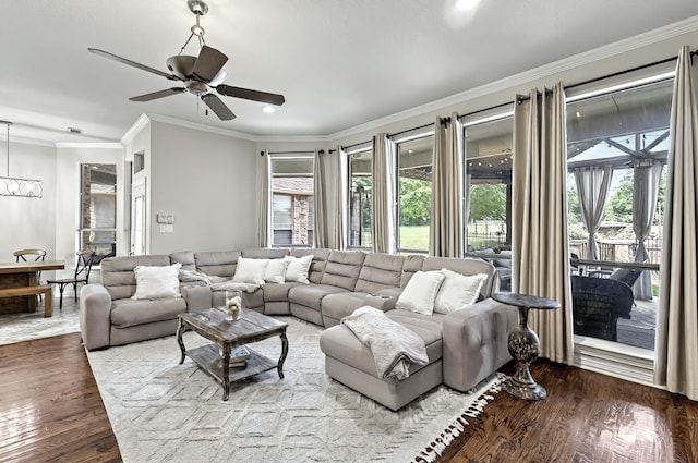 living room with plenty of natural light, ornamental molding, recessed lighting, and wood finished floors