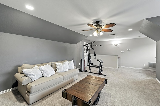 living area with baseboards, ceiling fan, light carpet, and visible vents