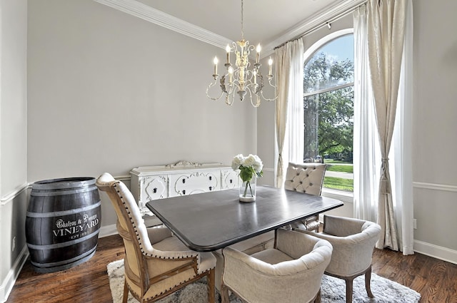 dining space with baseboards, a notable chandelier, ornamental molding, and dark wood-type flooring