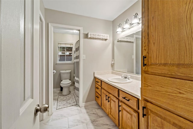 695 SE 32nd St, Paris, TX 75460 - full bath with vanity, baseboards, toilet, and marble finish floor
