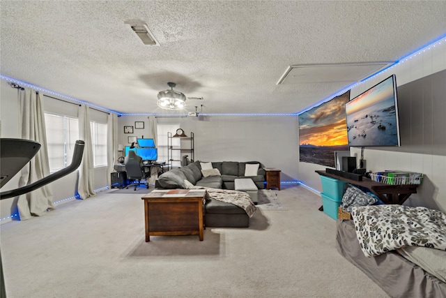 695 SE 32nd St, Paris, TX 75460 - carpeted living room featuring visible vents, a textured ceiling, and baseboards