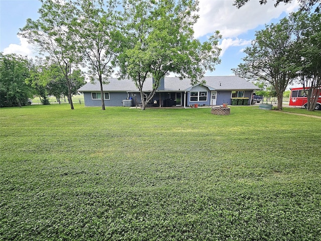 view of yard with an outdoor fire pit
