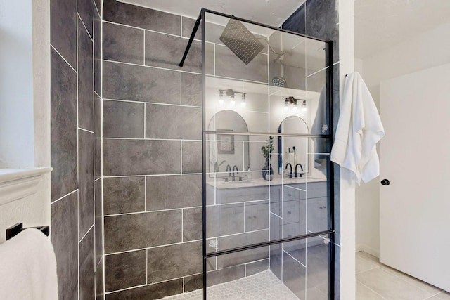 bathroom with walk in shower, tile patterned flooring, and vanity